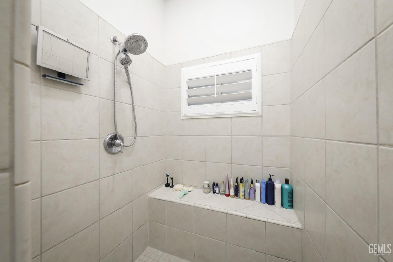 Undisclosed Address Bakersfield, CA 93312 - Photo 17 of 36 a bathroom with a sink and vanity