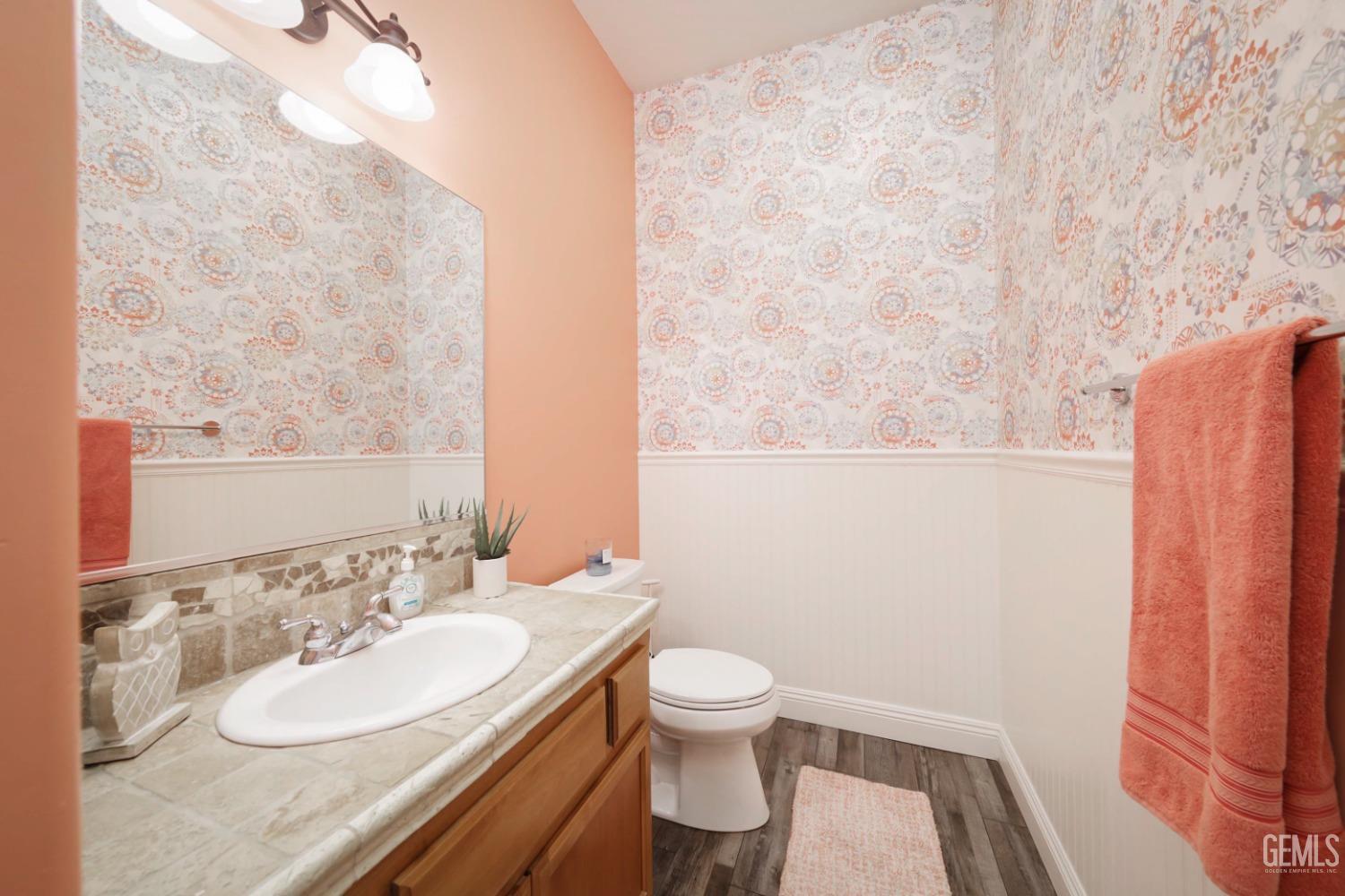 Undisclosed Address Bakersfield, CA 93312 - Photo 19 of 36 a bathroom with a granite countertop sink toilet and a mirror