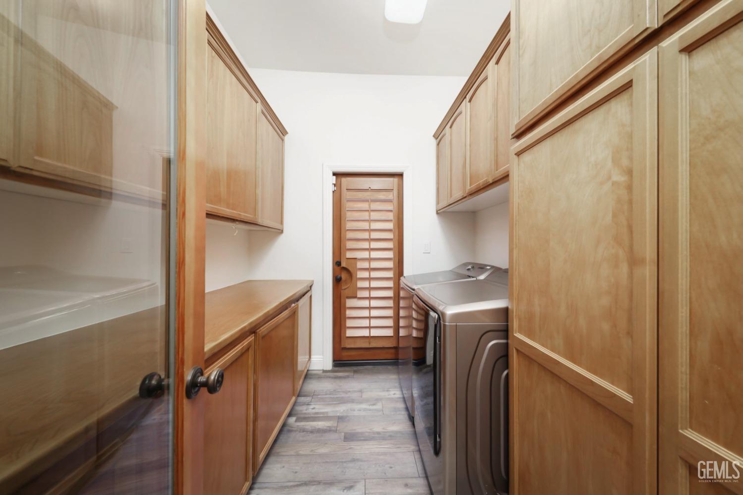 Undisclosed Address Bakersfield, CA 93312 - Photo 24 of 36 a view of a hallway with washer and dryer
