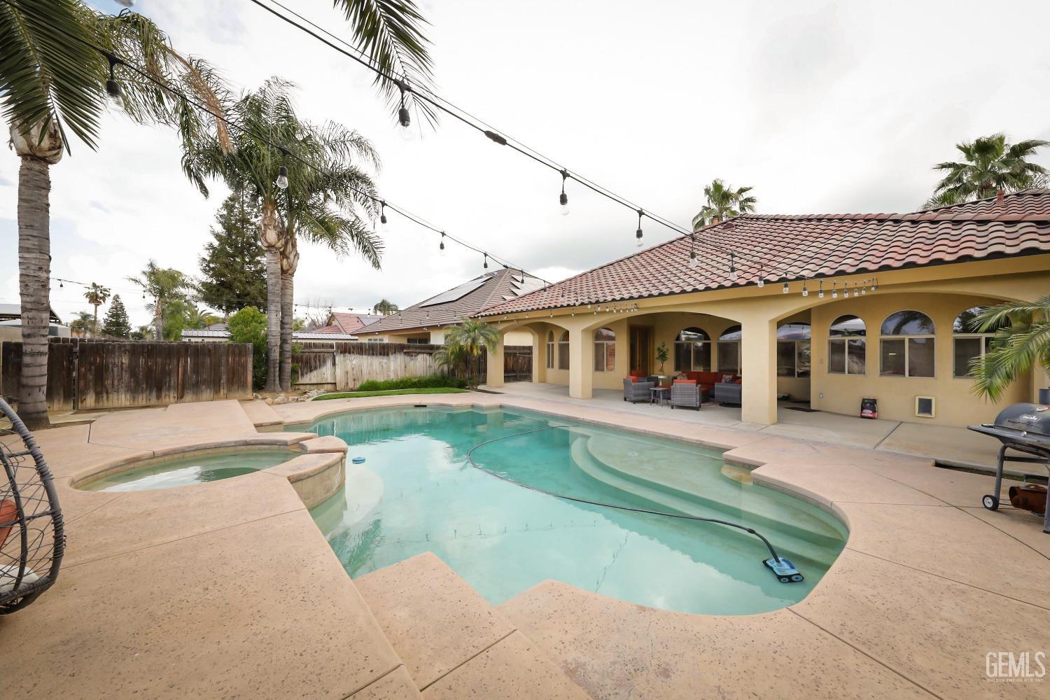 Undisclosed Address Bakersfield, CA 93312 - Photo 27 of 36 a front view of a house with garden
