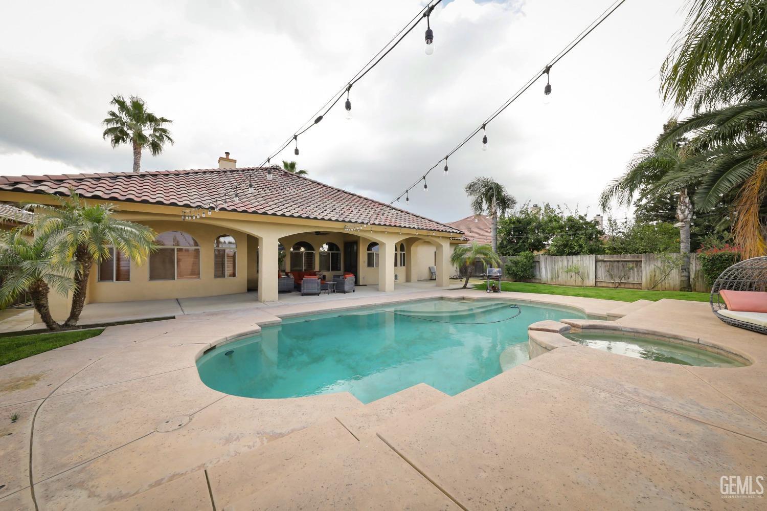 Undisclosed Address Bakersfield, CA 93312 - Photo 29 of 36 a front view of a house with garden