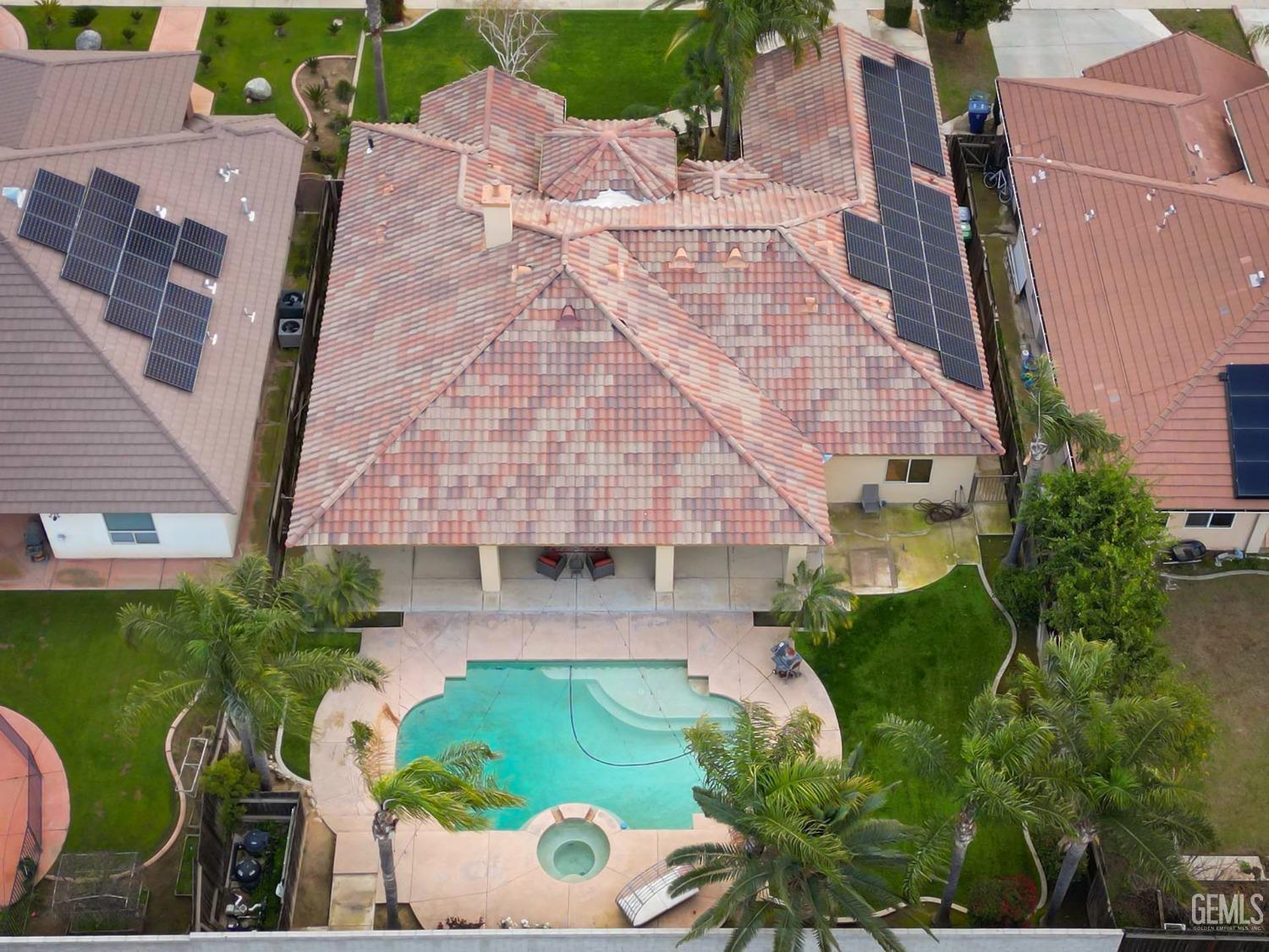 Undisclosed Address Bakersfield, CA 93312 - Photo 31 of 36 an aerial view of a house with garden space and street view