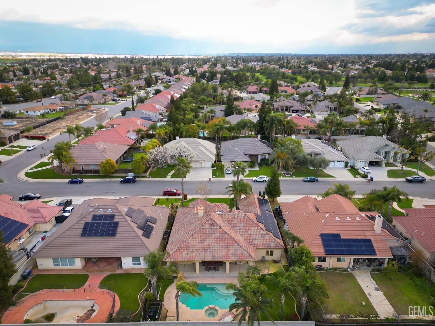 Undisclosed Address Bakersfield, CA 93312 - Photo 33 of 36 an aerial view of residential houses with outdoor space and parking