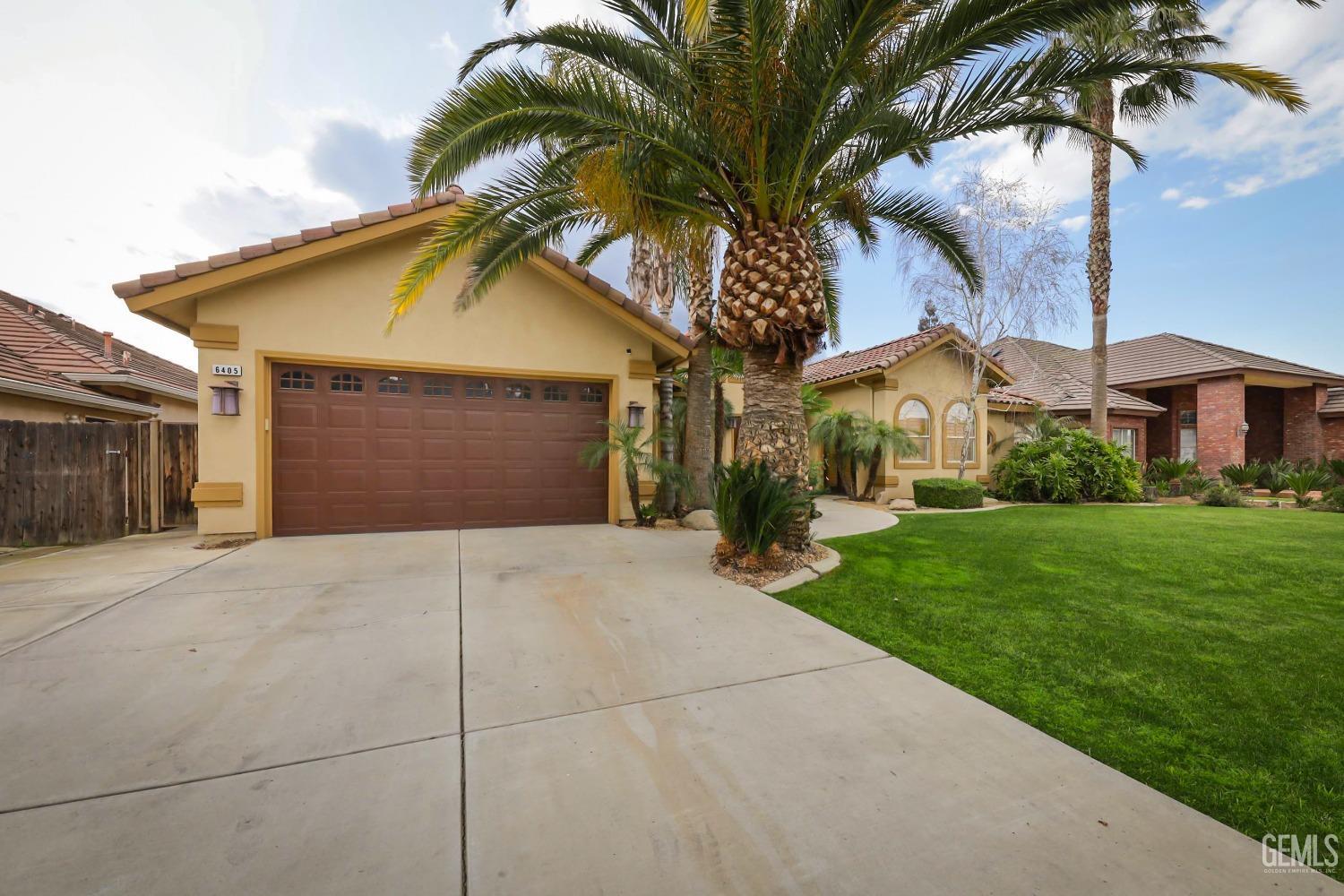 Undisclosed Address Bakersfield, CA 93312 - Photo 34 of 36 a front view of a house with garden