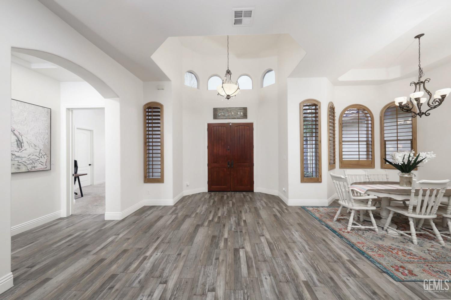 Undisclosed Address Bakersfield, CA 93312 - Photo 4 of 36 wooden floor in an empty room with a window