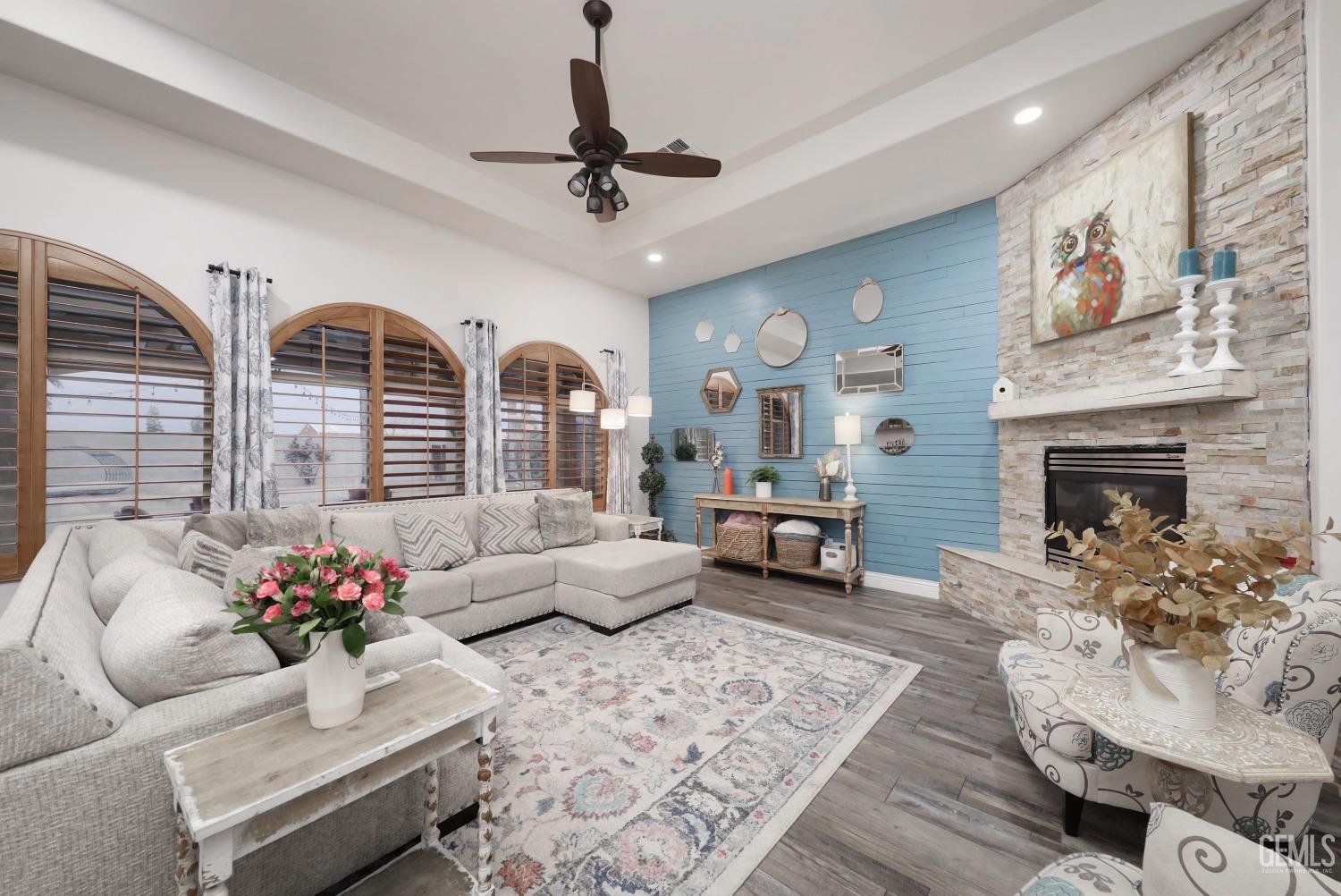 Undisclosed Address Bakersfield, CA 93312 - Photo 5 of 36 a living room with furniture and a fireplace