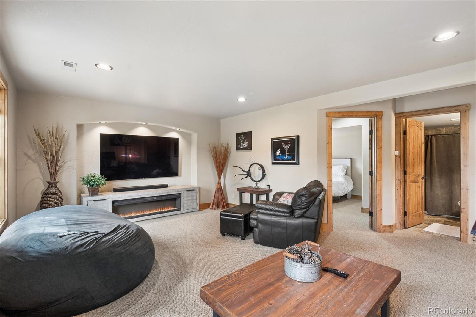 2894 County Road 43 Bailey, CO 80421 - Photo 19 of 40 a living room with furniture and a flat screen tv
