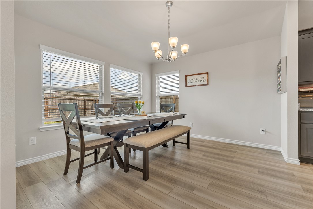 2016 Chief Street Bryan, TX 77807 - Photo 17 of 30 a view of a dining room with furniture window and wooden floor