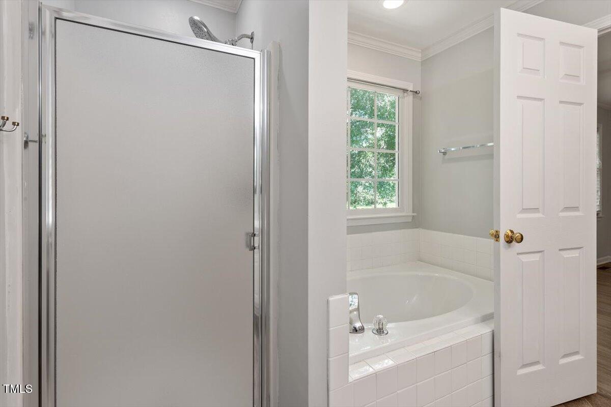 2474 Sumter Drive Garner, NC 27529 - Photo 17 of 27 a white bath tub with a shower