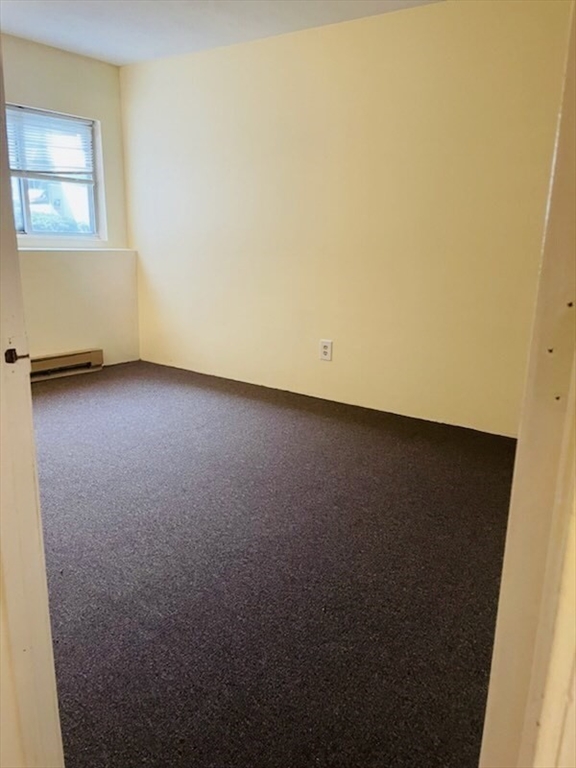 11 Gibbs Street, Unit A6 Worcester, MA 01607 - Photo 11 of 14 an empty room with a window