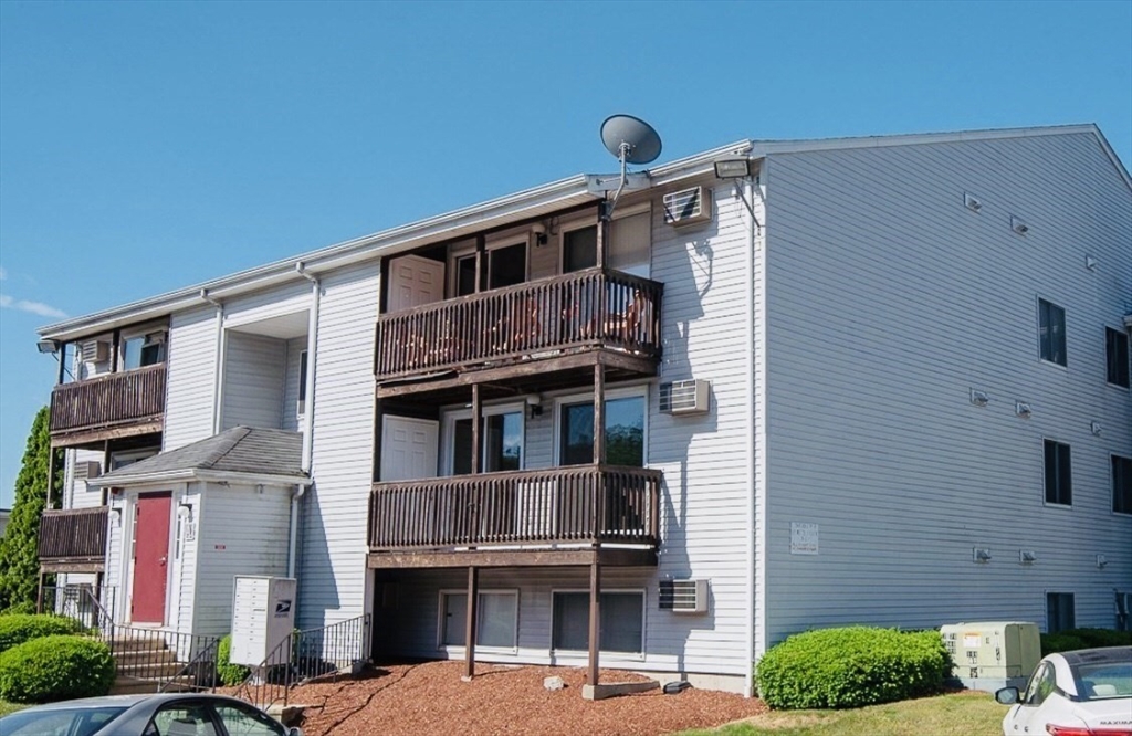 11 Gibbs Street, Unit A6 Worcester, MA 01607 - Photo 2 of 14 a front view of a building with balcony