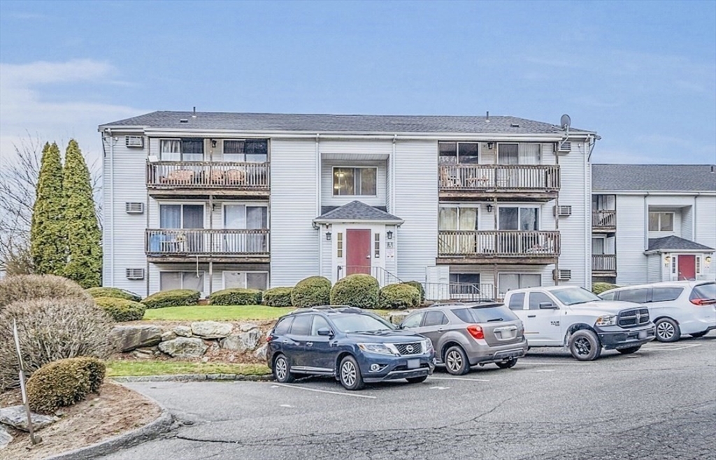 11 Gibbs Street, Unit A6 Worcester, MA 01607 - Photo 3 of 14 a front view of a residential apartment building with a yard