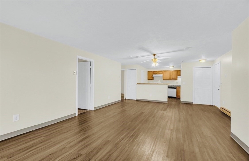 11 Gibbs Street, Unit A6 Worcester, MA 01607 - Photo 4 of 14 a view of a livingroom with wooden floor
