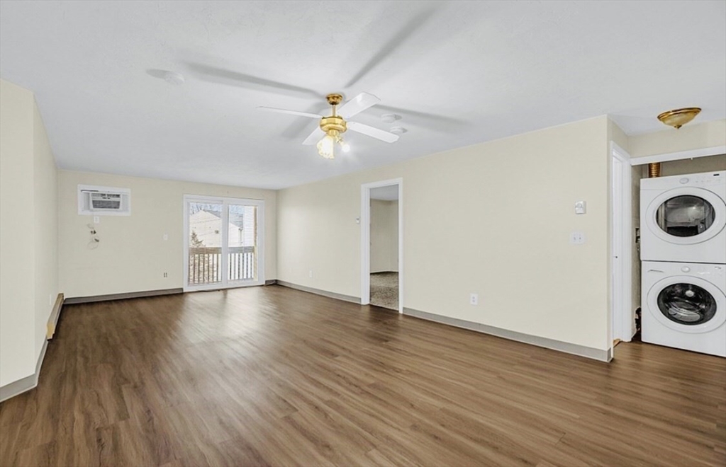 11 Gibbs Street, Unit A6 Worcester, MA 01607 - Photo 5 of 14 wooden floor in an empty room with a window