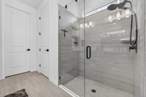 a bathroom with a double vanity sink mirror and double