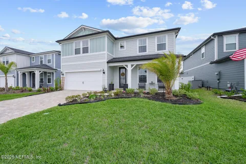 a view of a yard in front of a house
