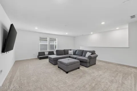 a bed room with a bed and a television