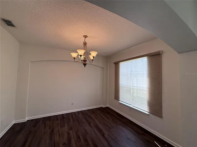 a bathroom with a granite countertop toilet a sink and bathtub
