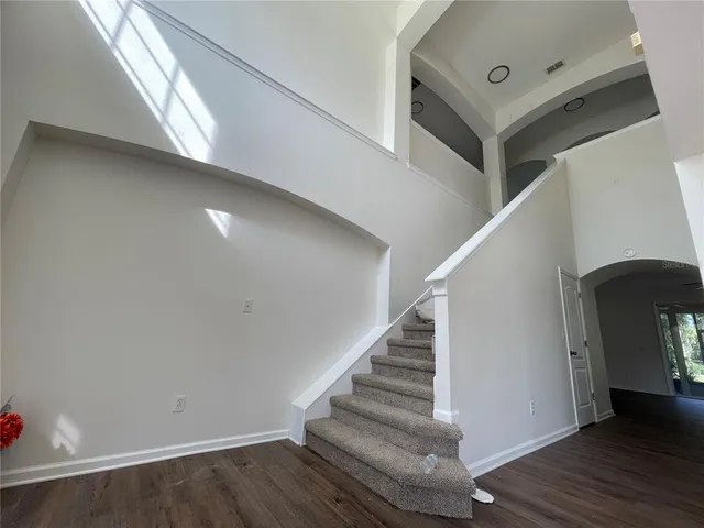 a view of entryway with wooden floor