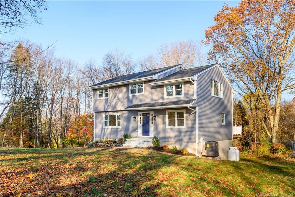 31 Langstroth Drive Ridgefield, CT 06877 - Photo 1 of 1 a view of a building with a yard
