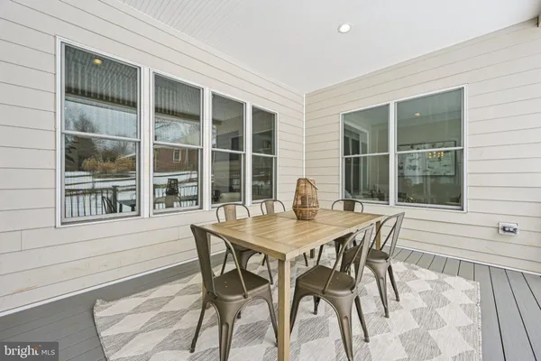 a view of a dining room with furniture and window
