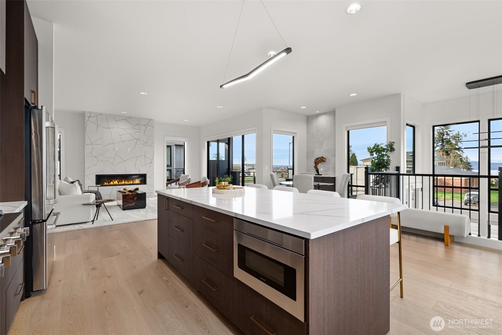 1422 Sequalish Street Steilacoom, WA 98388 - Photo 11 of 34 a large kitchen with stainless steel appliances lots of counter space and windows