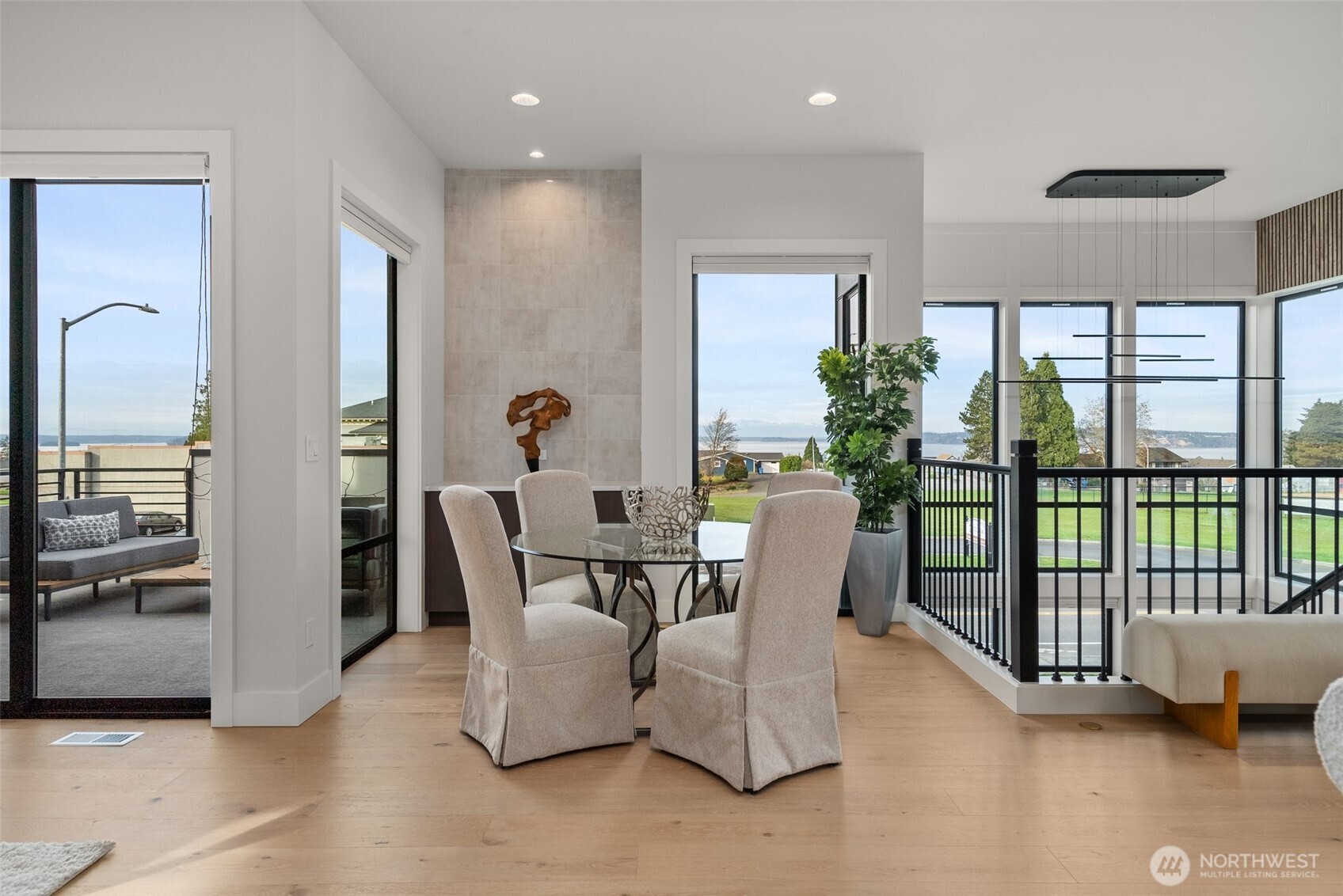 1422 Sequalish Street Steilacoom, WA 98388 - Photo 13 of 34 a dining room with furniture and a floor to ceiling window