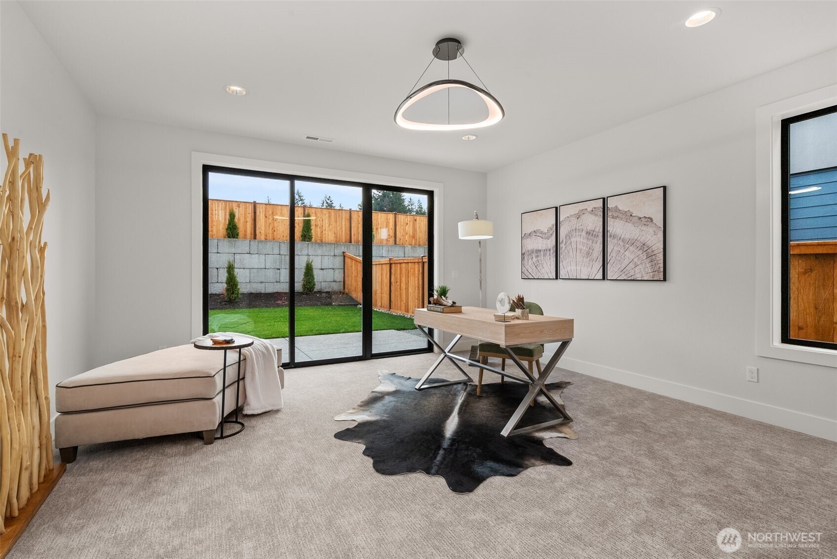 1422 Sequalish Street Steilacoom, WA 98388 - Photo 25 of 34 a living room with furniture and a floor to ceiling window
