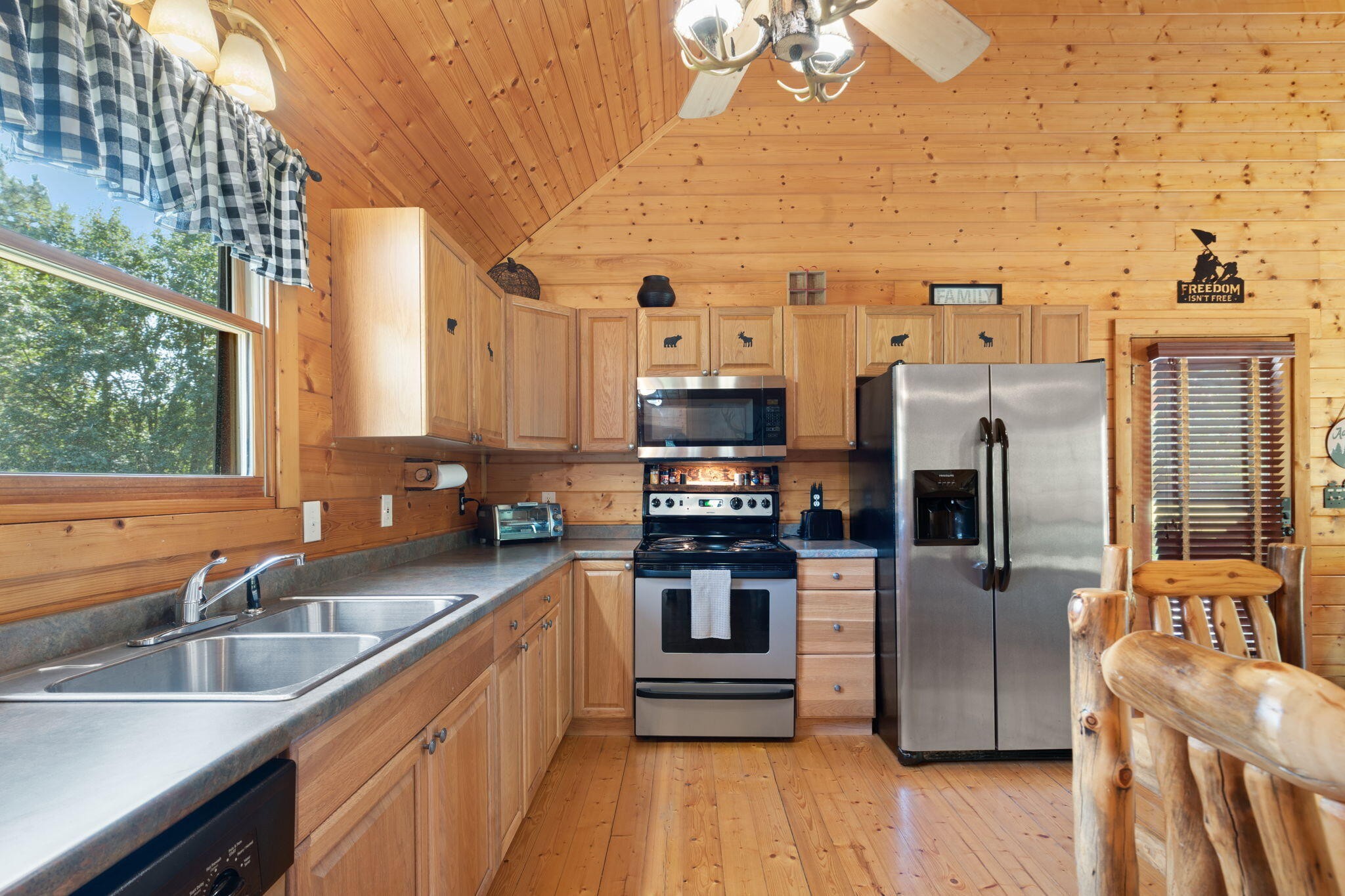 947 Belltown Road Copperhill, TN 37317 - Photo 6 of 26 a kitchen with stainless steel appliances a sink a stove and a wooden floors