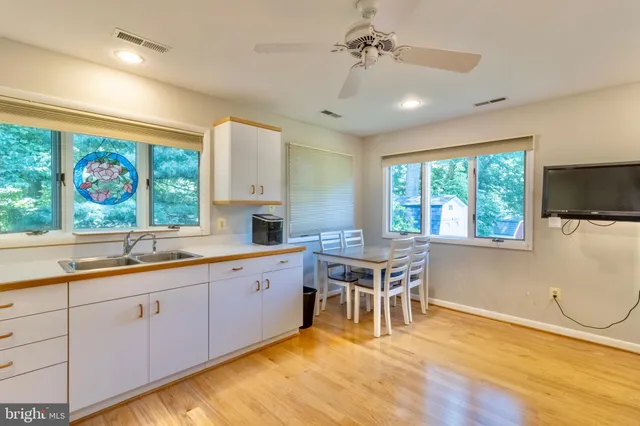 a kitchen with a stove a sink and a refrigerator