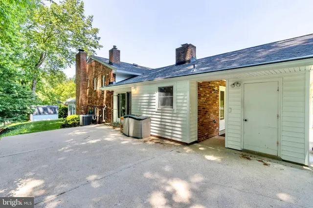 a view of a house with a yard and garage
