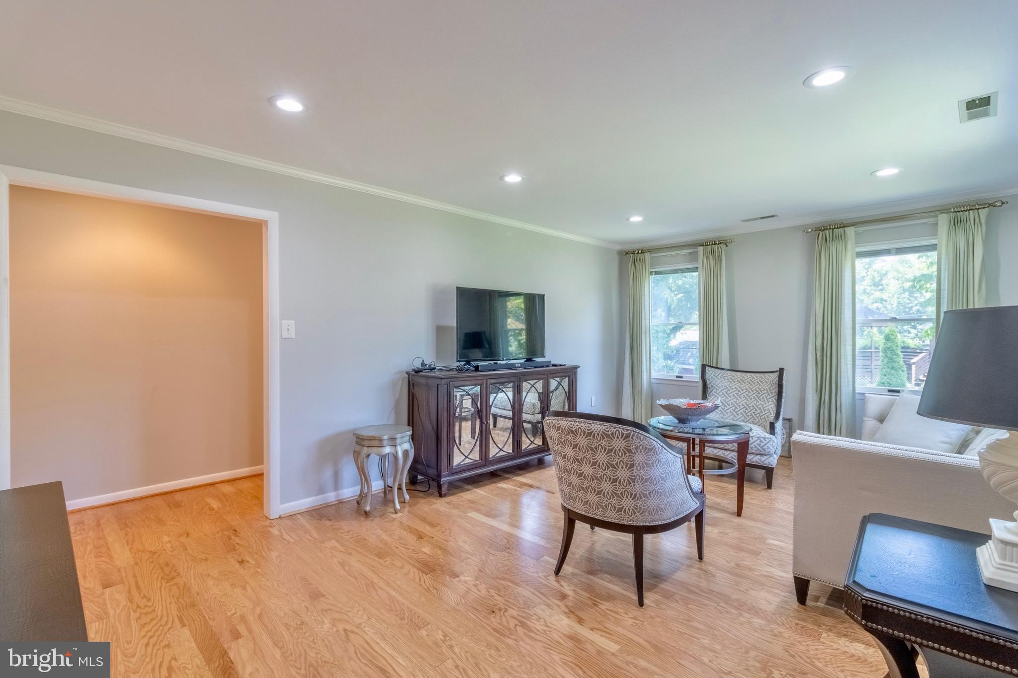 7613 Hamlet Street Springfield, VA 22151 - Photo 5 of 18 a living room with furniture a window and a flat screen tv