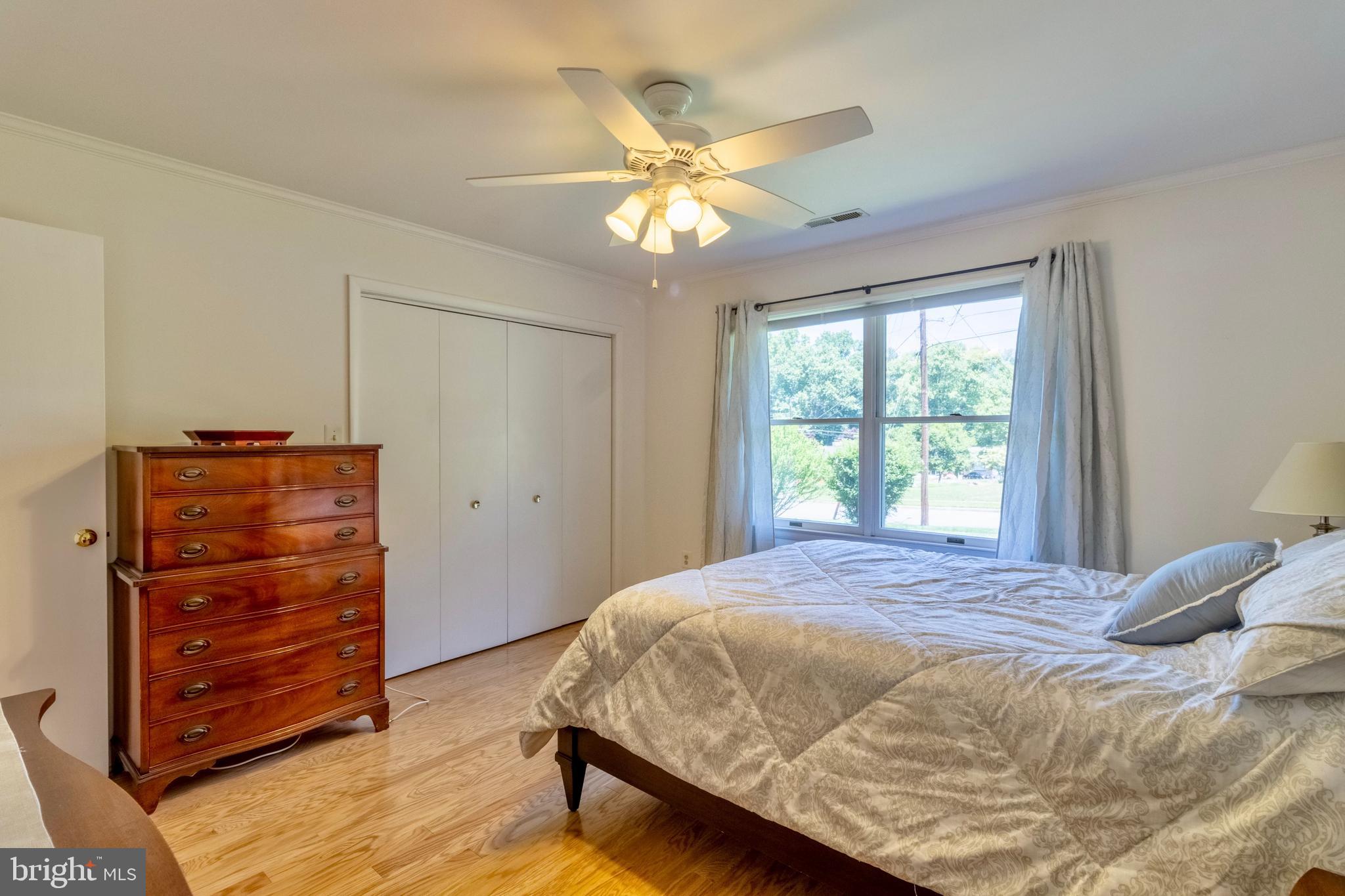 7613 Hamlet Street Springfield, VA 22151 - Photo 7 of 18 a bedroom with a bed and a dresser