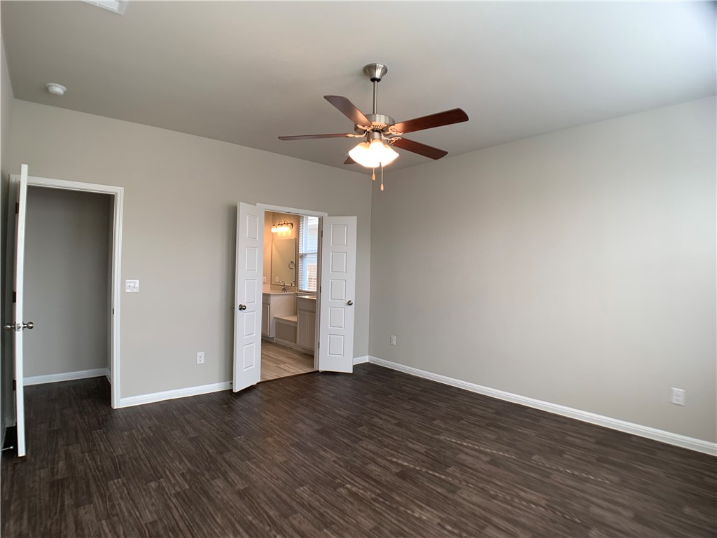 237 Michaelis Drive Leander, TX 78641 - Photo 11 of 23 a view of an empty room with wooden floor