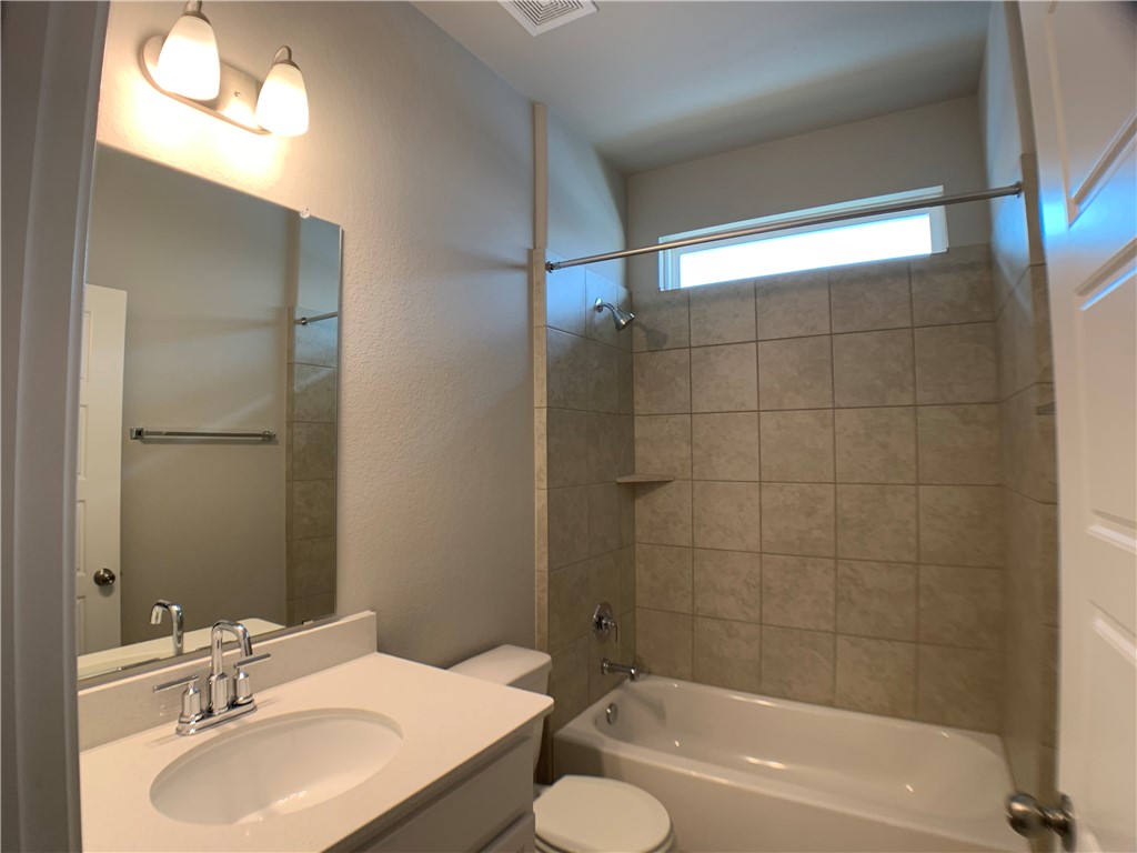 237 Michaelis Drive Leander, TX 78641 - Photo 17 of 23 a bathroom with a sink toilet and shower