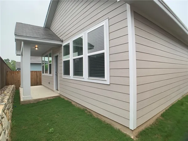 a view of a back yard of the house