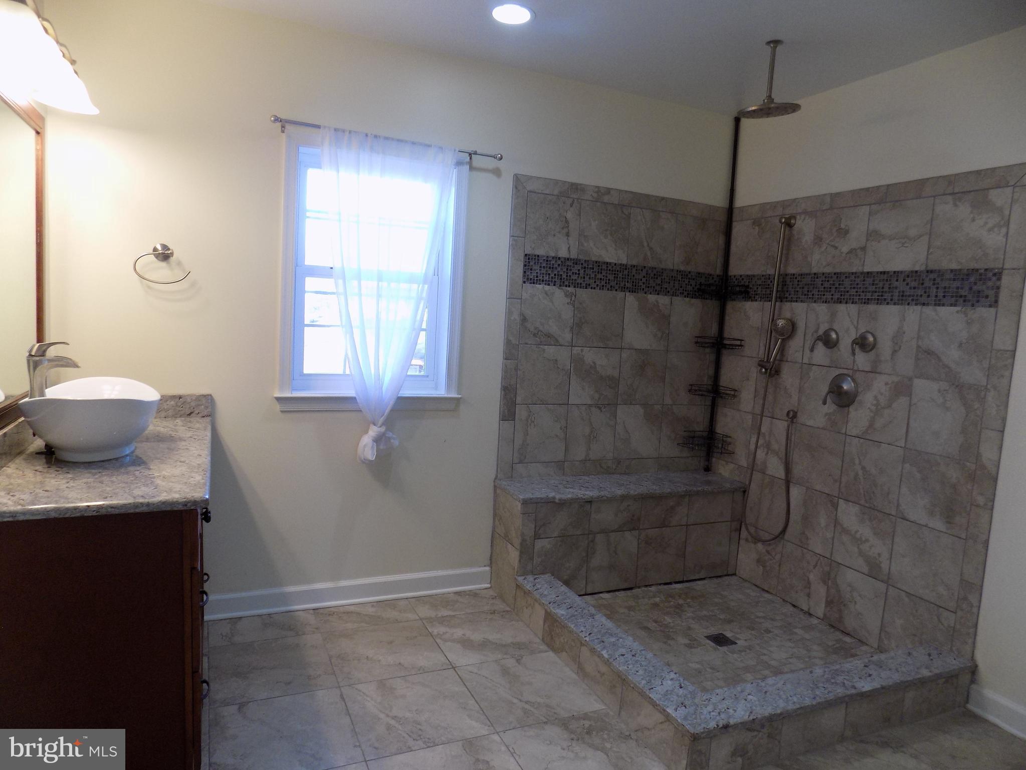 53 Sunset Avenue, Unit 3 Chalfont, PA 18914 - Photo 12 of 20 a bathroom with a shower and a sink