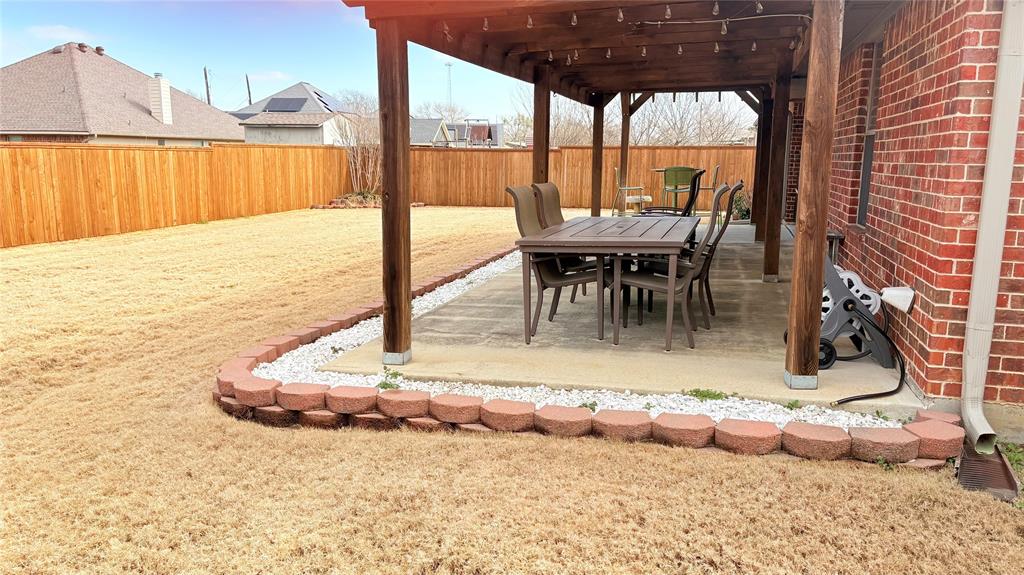312 McAfee Street Mabank, TX 75147 - Photo 10 of 40 a view of a swimming pool with a lounge chairs