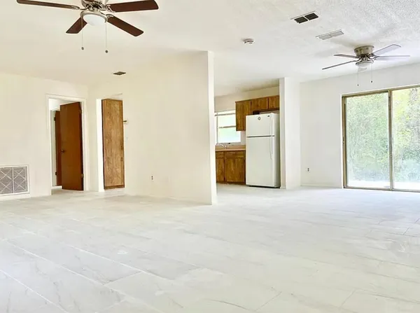a view of an empty room with a window