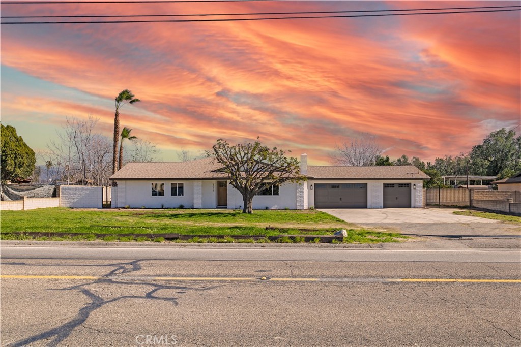 front view of a house next to a yard