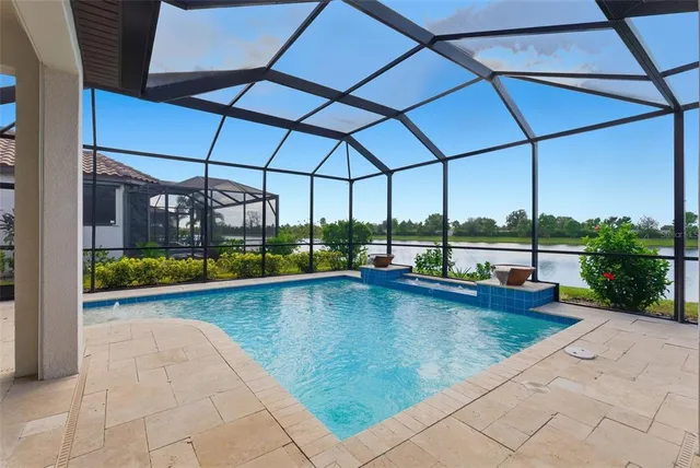 a view of swimming pool with a patio