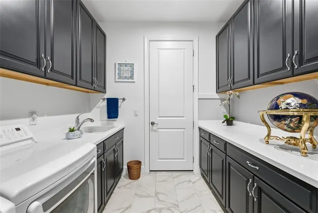a kitchen with a sink and cabinets