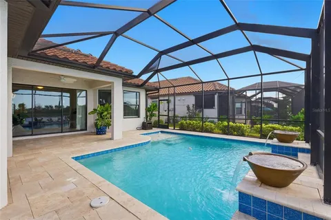 a view of swimming pool with a patio