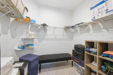 a reading room with furniture and book shelf