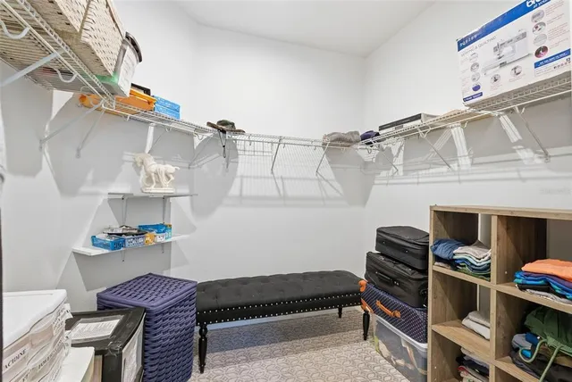 a reading room with furniture and book shelf