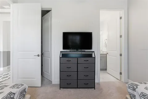 a room with furniture and flat screen tv