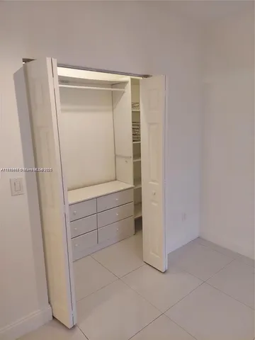 a front view of a house with a yard and a garage