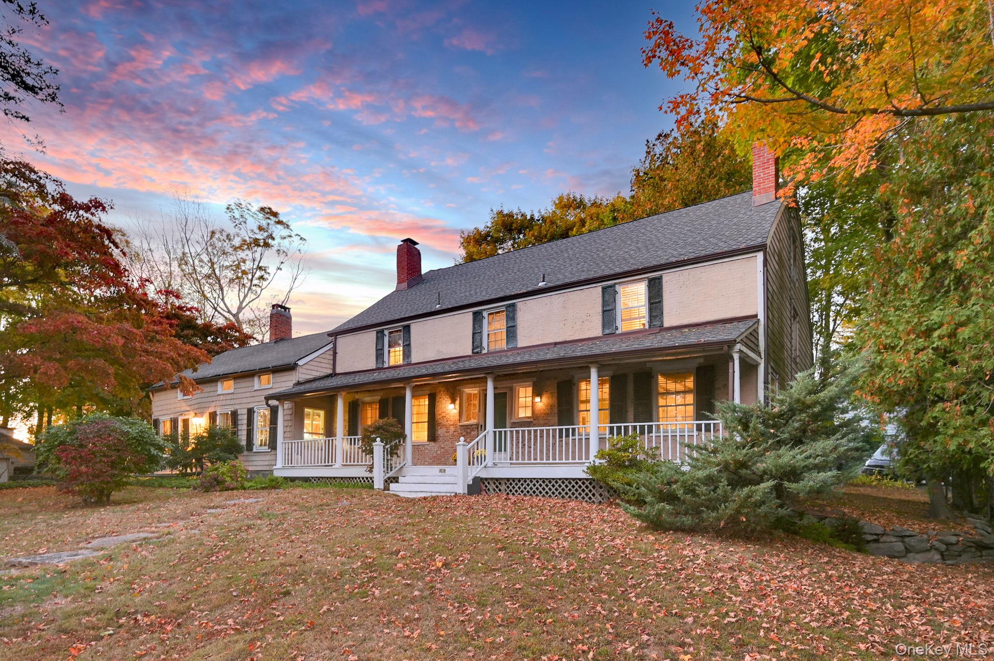 33 Ryder Road Ossining, NY 10562 - Photo 37 of 48 View of front facade with a chimney, a porch, and a lawn