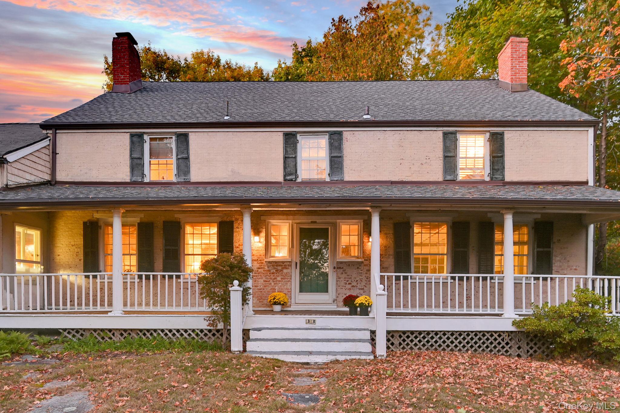 33 Ryder Road Ossining, NY 10562 - Photo 38 of 48 Farmhouse inspired home with a chimney, covered porch, brick siding, and a shingled roof