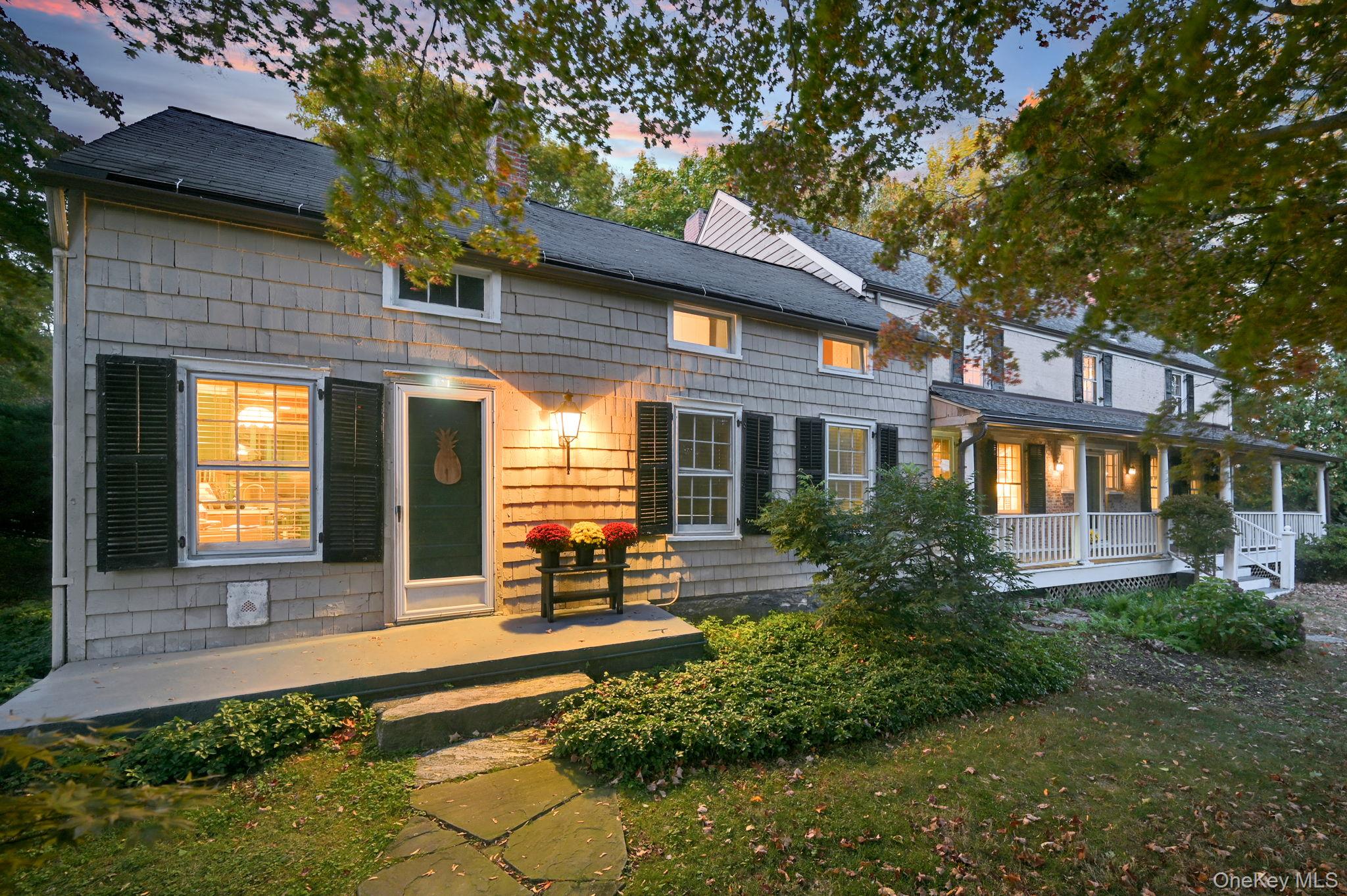 33 Ryder Road Ossining, NY 10562 - Photo 42 of 48 Back of property at dusk featuring a porch and a lawn